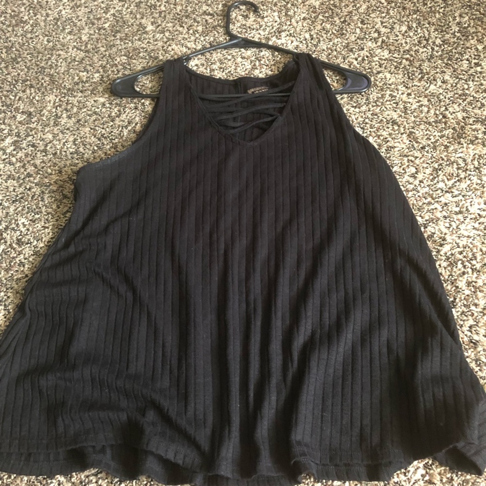 Sleeveless top with lace up top.